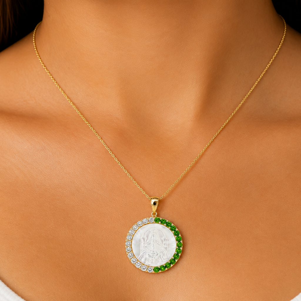 Virgen de Coromoto gold medal with tsavorite garnet border, detail view