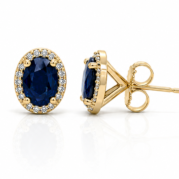 14k yellow gold halo stud earrings with 1.80 ct oval blue sapphires