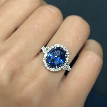 18k gold ring with oval blue sapphire double cabochon and diamond halo