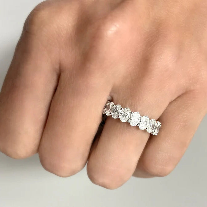 platinum eternity band with oval-cut diamonds totaling 4.54 cts