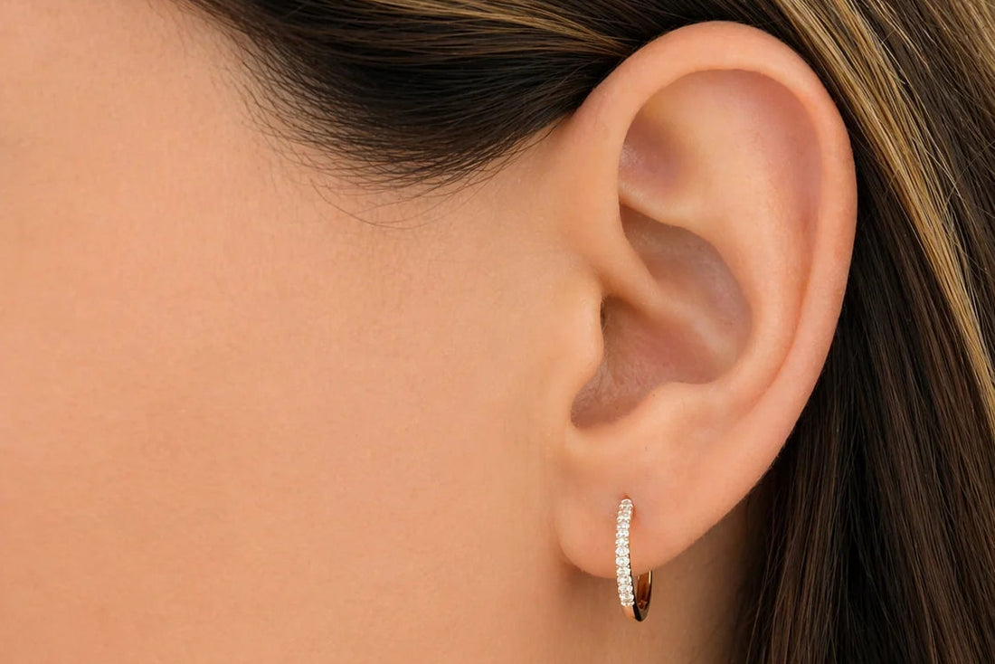 oval diamond mini hoop earrings in 14k yellow gold with diamond accents