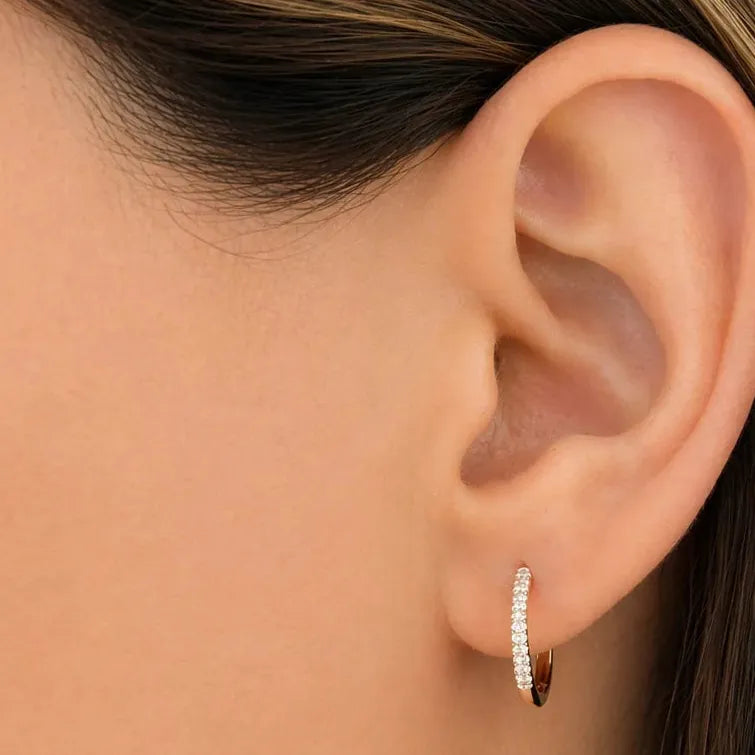 oval diamond mini hoop earrings in 14k yellow gold with diamond accents