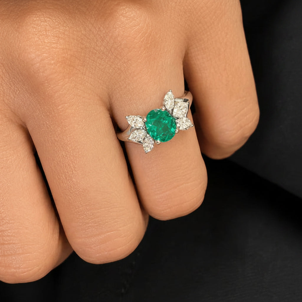 18k gold ring with oval emerald and marquise diamond side stones