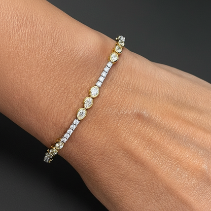 Close view of the oval Fancy Yellow diamonds framed in yellow gold