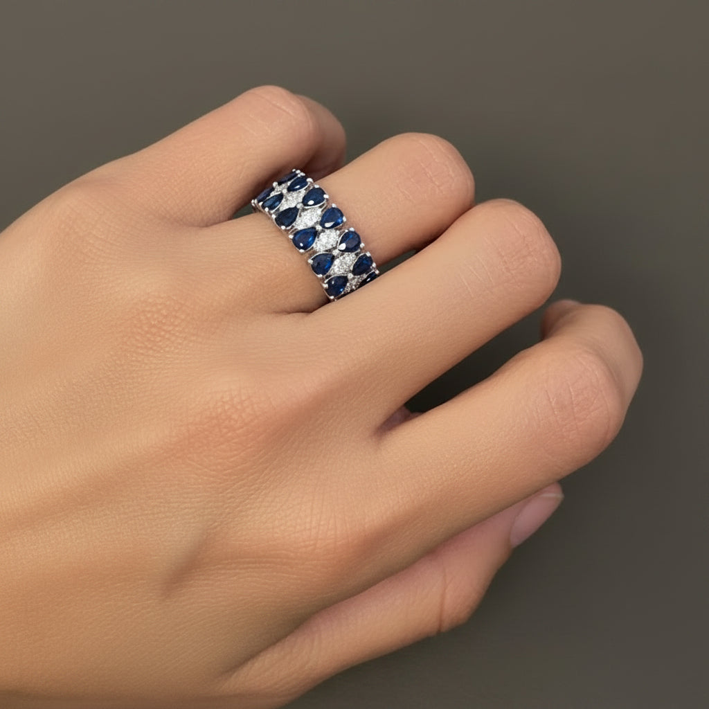 pear blue sapphire and diamond ring in 14k gold