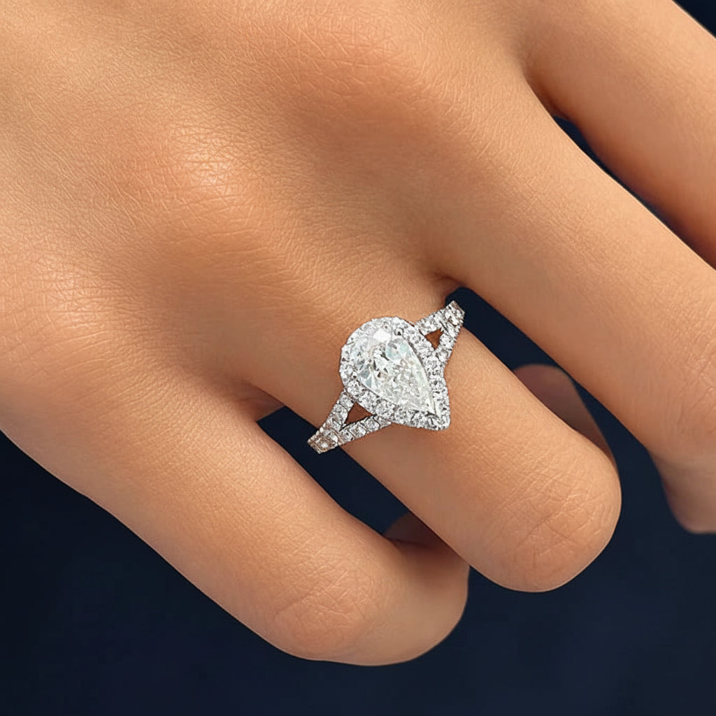 18k white gold ring with GIA pear diamond and split shank diamond bands