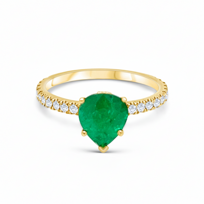 18k yellow gold pear emerald ring with round brilliant diamonds by Diamond Tales