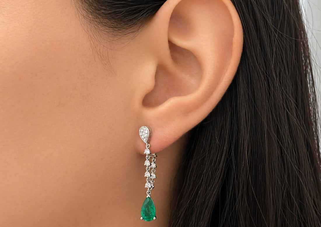18k white gold drop earrings with pear emeralds and inside-out diamond halos—front and back—structurally refined