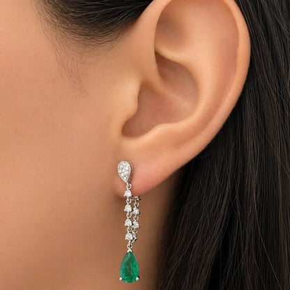 18k white gold drop earrings with pear emeralds and inside-out diamond halos—front and back—structurally refined