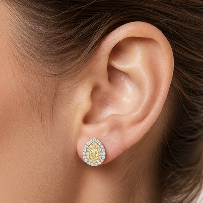 Detail of the double halo setting around the pear Fancy Yellow diamond