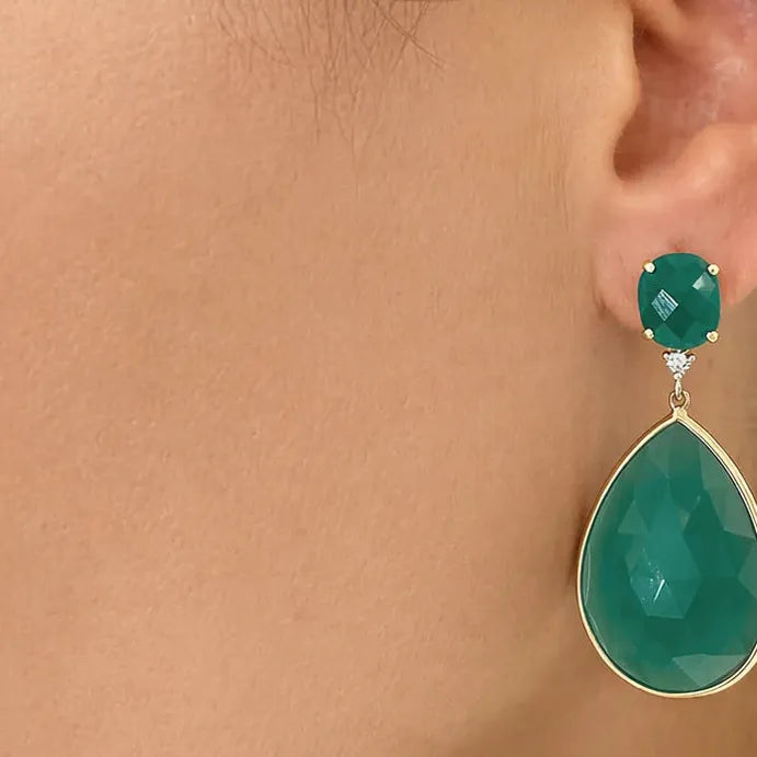 14k gold stud earrings with pear and oval green agate surrounded by diamonds
