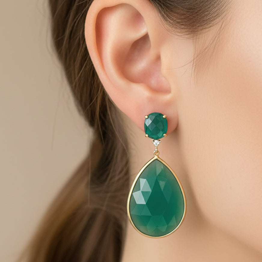 14k gold stud earrings with pear and oval green agate surrounded by diamonds
