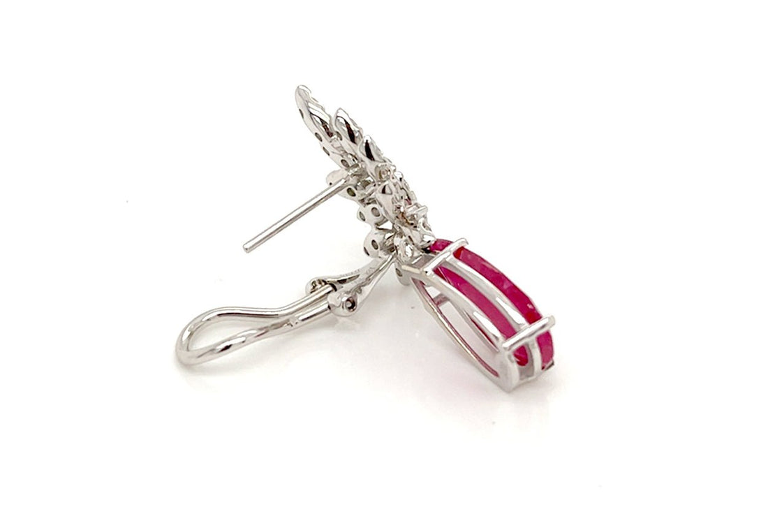 18k white gold drop earrings with pear rubies and brilliant‐cut diamond accents