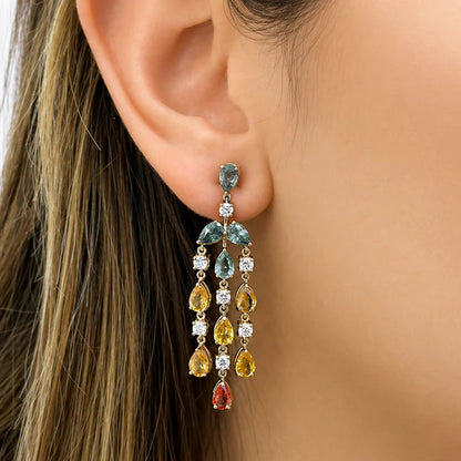 18k gold chandelier earrings with pear sapphire tiers and round diamond accents