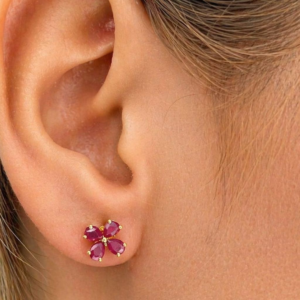 18k gold flower stud earrings composed of pear-shaped colored gemstones in a floral arrangement