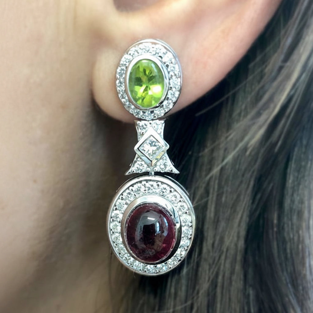 18k gold earrings with peridot, tourmaline cabochons, and diamonds by Diamond Tales