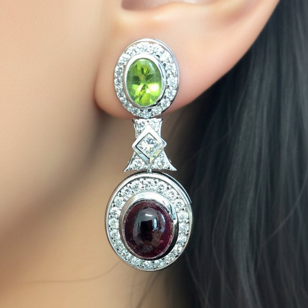 18k gold earrings with peridot, tourmaline cabochons, and diamonds by Diamond Tales