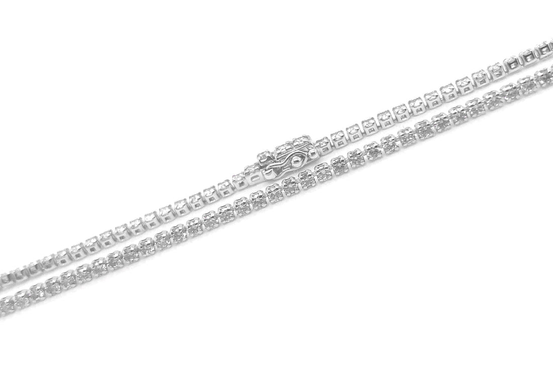 18k white gold perpetual tennis bracelet with round brilliant diamonds by Diamond Tales