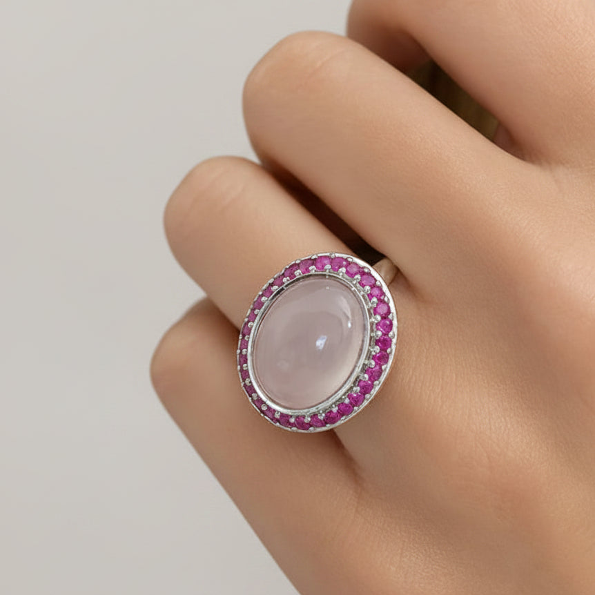18k white gold ring with pink quartz, blue sapphires, and diamond accents