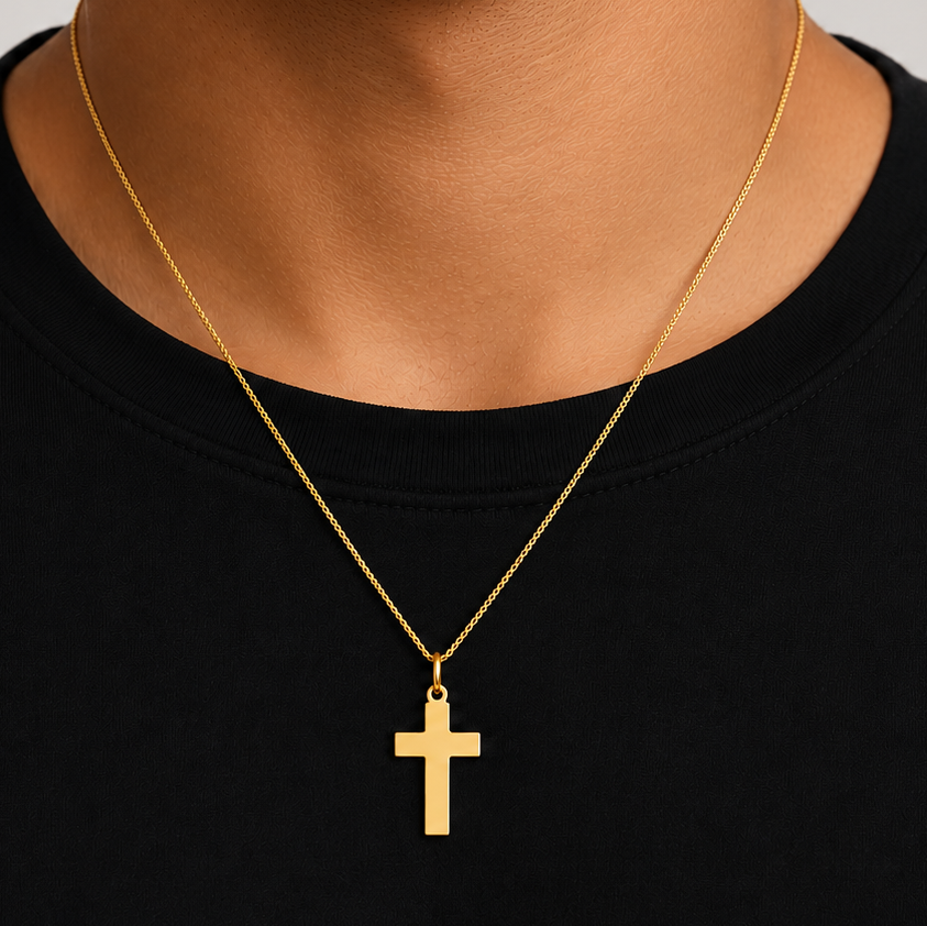 polished 14k gold cross pendant, close up
