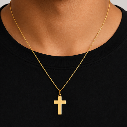 polished 14k gold cross pendant, close up