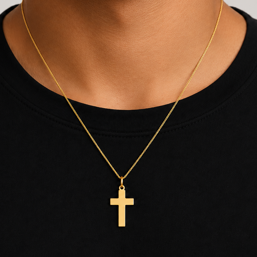 polished 18k gold cross pendant, close up