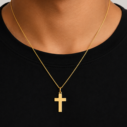 polished 18k gold cross pendant, close up