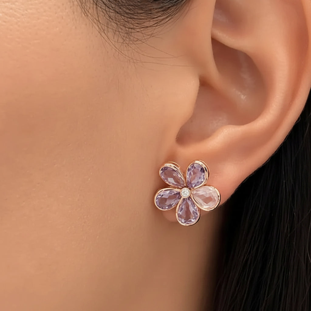 Flower-shaped amethyst quartz earring worn on an ear 