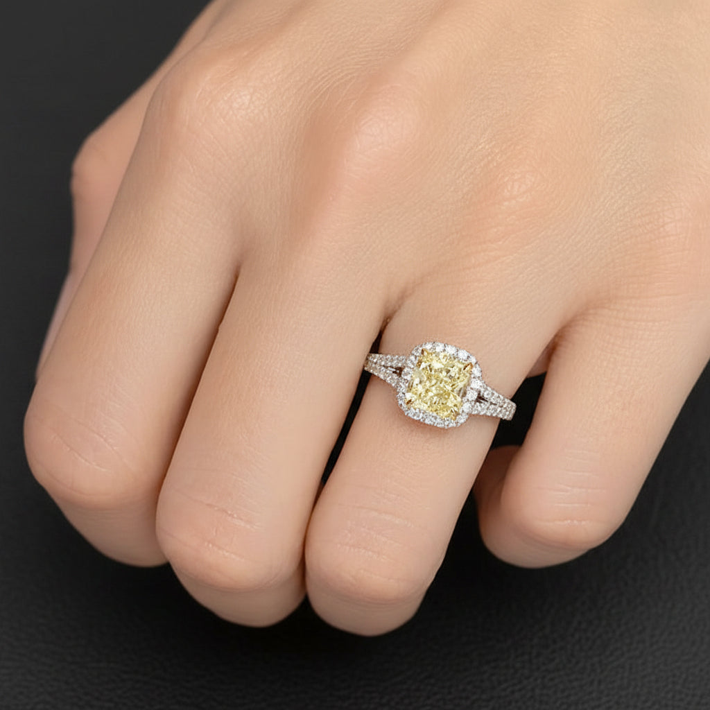 Platinum ring with radiant-cut yellow diamond and diamond pave split shank