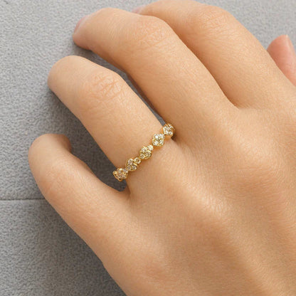 18k yellow gold ring with seven interlocking heart shapes set with round brilliant diamonds