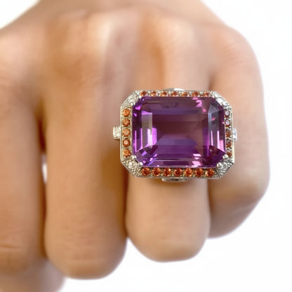 18k yellow gold ring with amethyst center and pavé orange sapphire and diamond accents
