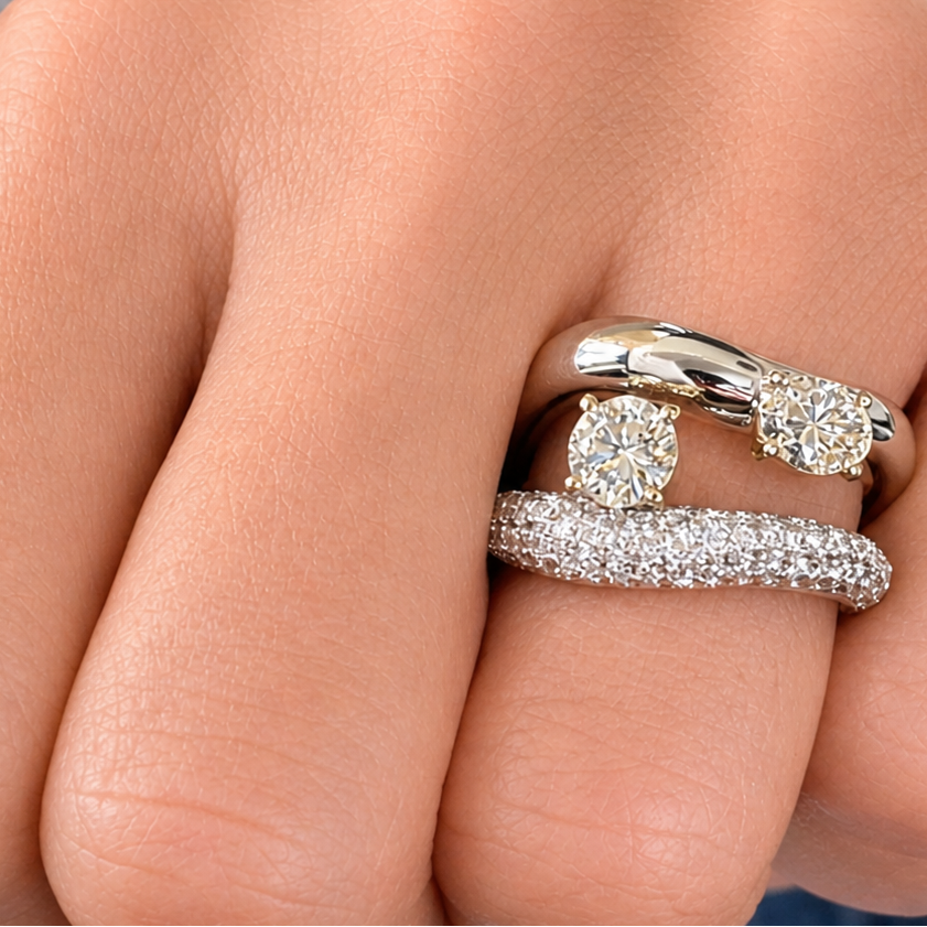 18k gold double curved band ring with round and oval diamonds by Diamond Tales