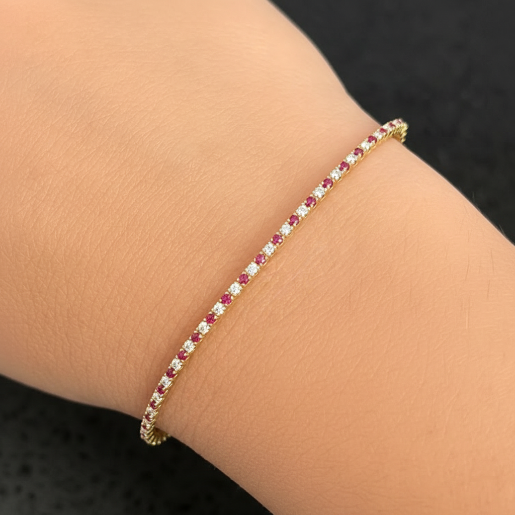 14k yellow gold bangle bracelet with rubies and round brilliant diamonds by Diamond Tales
