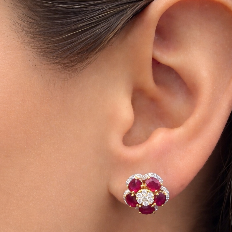 18k yellow and white gold ruby and diamond flower earrings by Diamond Tales