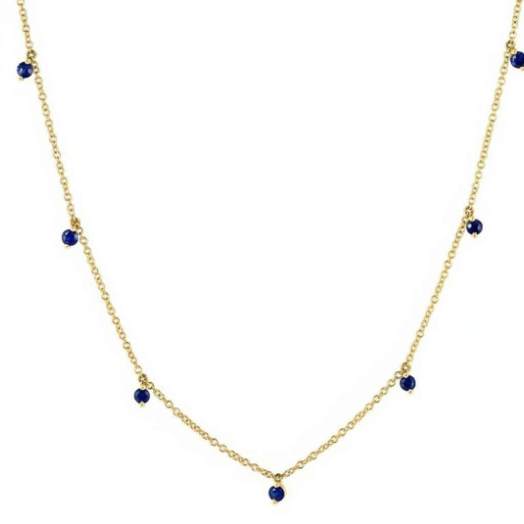 sapphire shaker pendant necklace in 14k gold with moving round sapphires