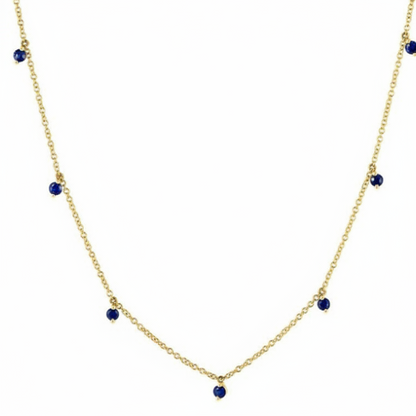 sapphire shaker pendant necklace in 14k gold with moving round sapphires