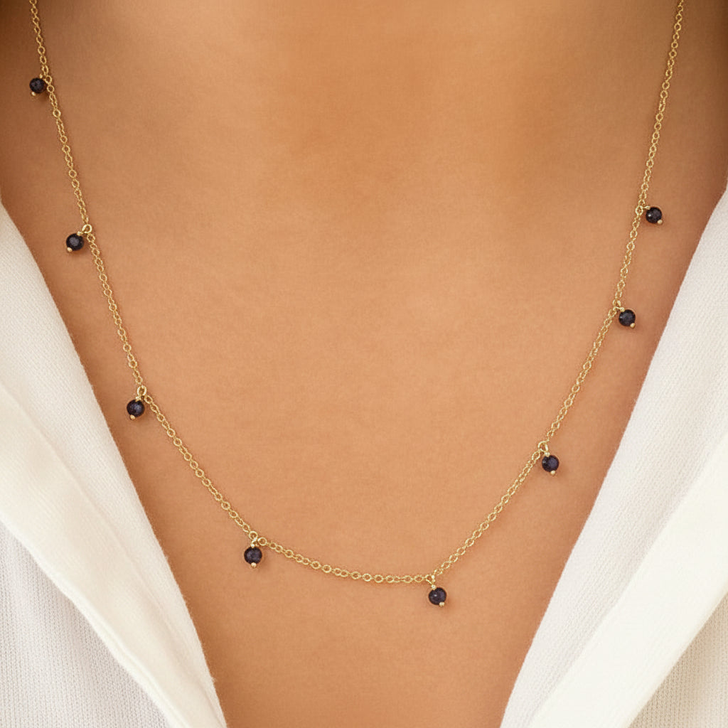 sapphire shaker pendant necklace in 14k gold with moving round sapphires