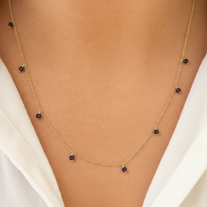 sapphire shaker pendant necklace in 14k gold with moving round sapphires
