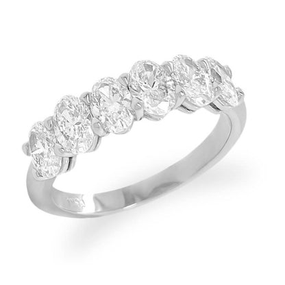 Platinum band featuring six oval-cut diamonds in a clean, linear setting
