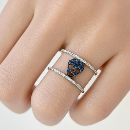 18k gold skull ring with blue sapphires and double row diamonds by Diamond Tales