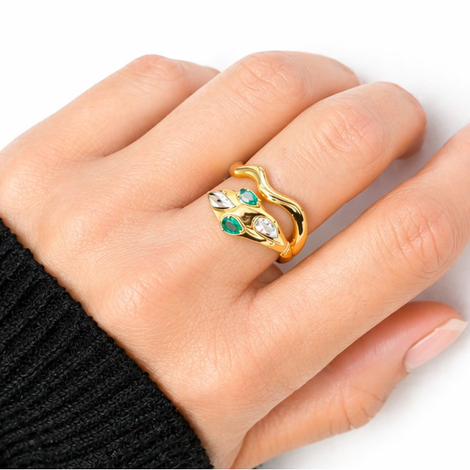 18k yellow gold snake ring with emeralds and pavé diamonds by Diamond Tales