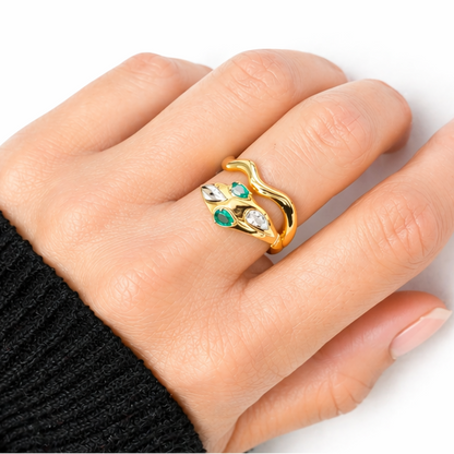 18k yellow gold snake ring with emeralds and pavé diamonds by Diamond Tales