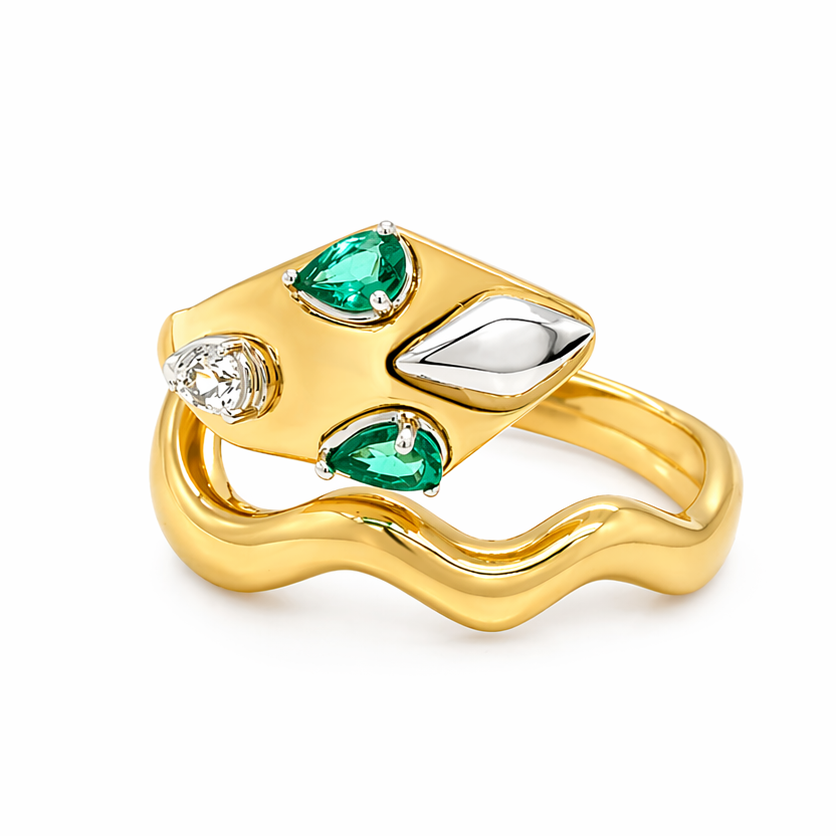 18k yellow gold snake ring with emeralds and pavé diamonds by Diamond Tales