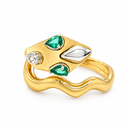 18k yellow gold snake ring with emeralds and pavé diamonds by Diamond Tales