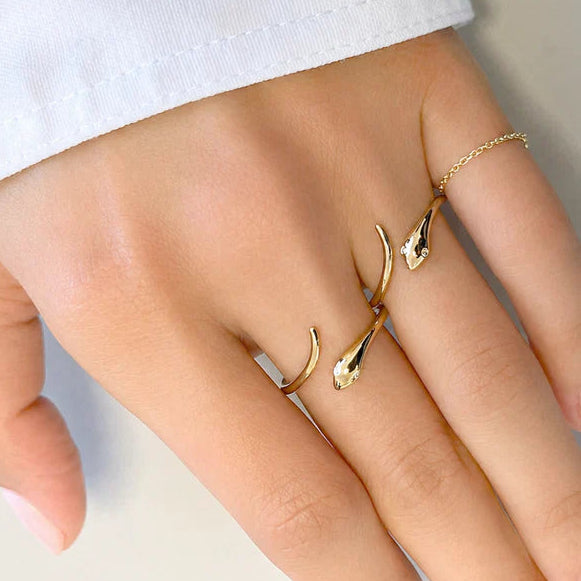 14k rose gold ring shaped as a coiled snake with diamond-set eyes