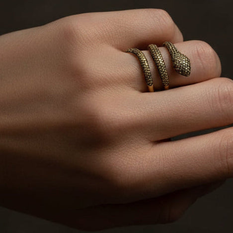 18k yellow gold snake ring with rubies and yellow pave diamonds totaling approximately 0.99 carats