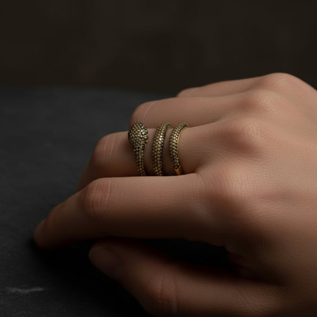 18k yellow gold snake ring with rubies and yellow pave diamonds totaling approximately 0.99 carats
