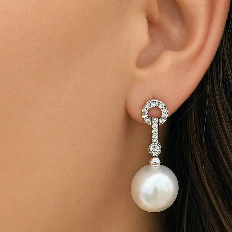 18k white gold dangle earrings with South Sea pearl drops and diamond accents