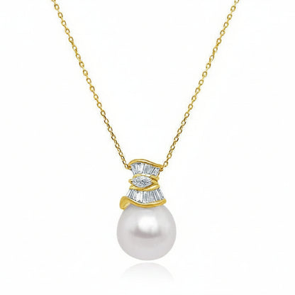 18k gold necklace with a 13.5 mm South Sea pearl, 13 tapered-baguette diamonds totaling 0.38 carats, and one 0.05 carat marquise diamond