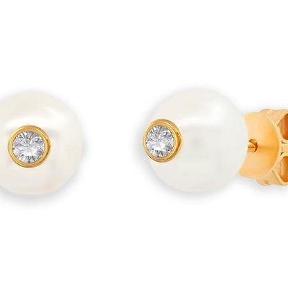 18k gold stud earrings featuring South Sea pearls with diamond accents